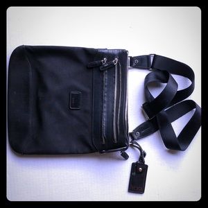Tumi crossbody bag. Strong. Amazing purse!